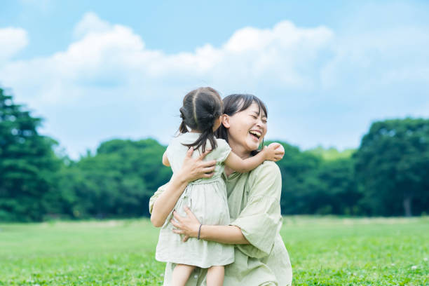 istock mother and her daughter hugging in the park 1403096375