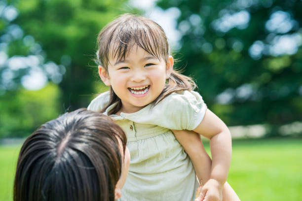 istock mother and her daughter hugging in the park 1403096486