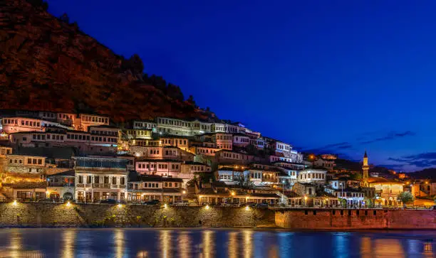Skyline of the old city of Berat with its ancient houses, at the dusk in Albania.