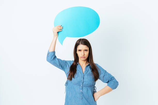 istock Angry displeased young woman with speech bubble 1403098763