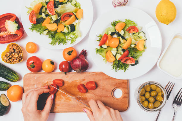 istock Female hands make greek salad 1403098819