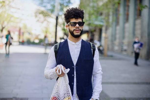 istock Young man with eco-friendly reusable cotton bag, zero waste concept 1403098993