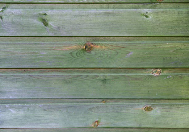 istock Old green wooden wall. 1403099244
