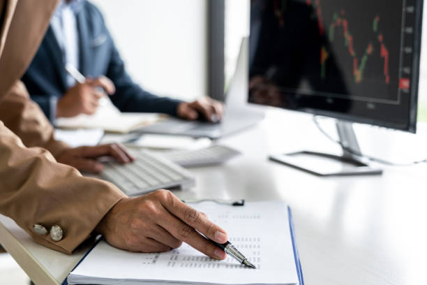 istock Business team partner working with computer, laptop, discussion and analyzing graph stock market trading with stock chart data planning, financial and investment concept 1403099885
