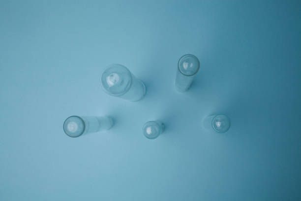 istock Round bottom glass test tube in blue background 1403101500