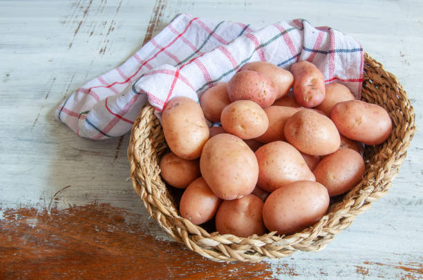 istock potatoes on a wooden table 1403103879