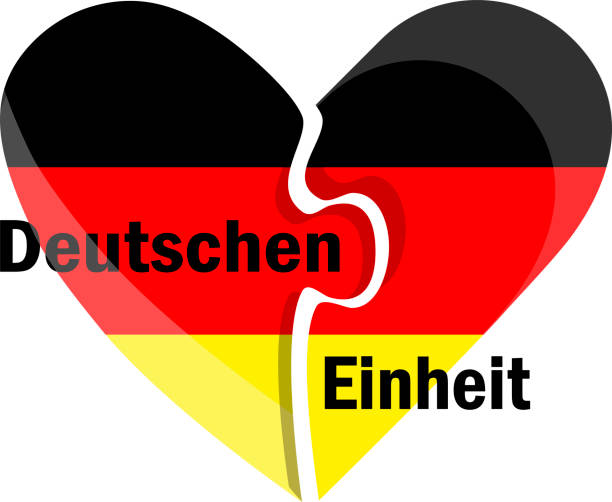 istock German unity day (Deutschen Einheit) vector illustration, Puzzle heart in colours of German Flag 1403105450