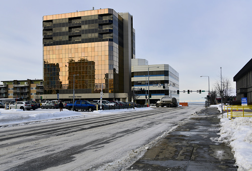 Anchorage, Alaska, USA: glass façade of the Peterson tower - 10-story high-rise built in 1976 - view along West 5th Avenue, downtown