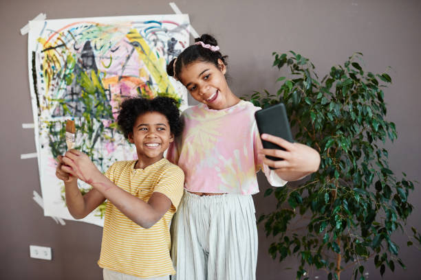 istock Children making selfie portrait on smartphone 1403112189