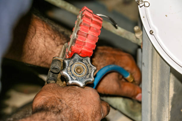 istock electrician fixing air conditioner wires 1403112980