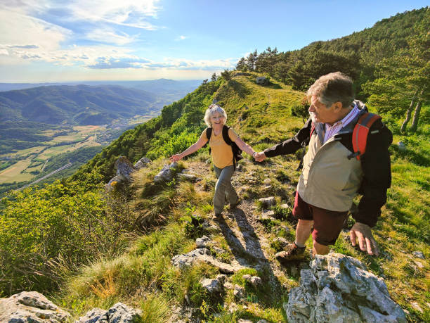 istock Two Seniors Hiking and Walking Off The Beaten Path 1403117321