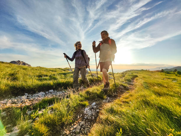 istock Two Seniors Hiking and Walking Off The Beaten Path 1403117681