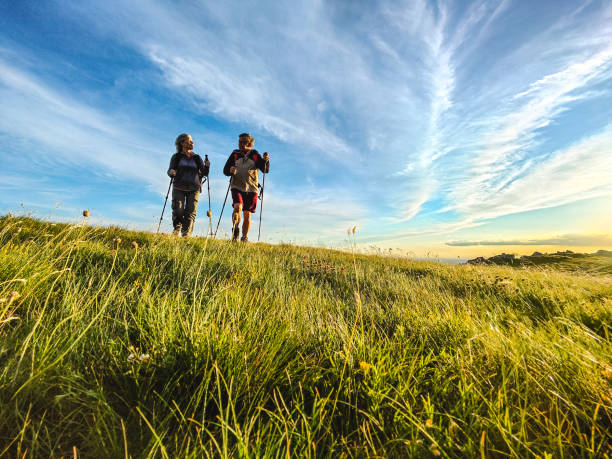 istock Two Seniors Hiking and Walking Off The Beaten Path 1403117729