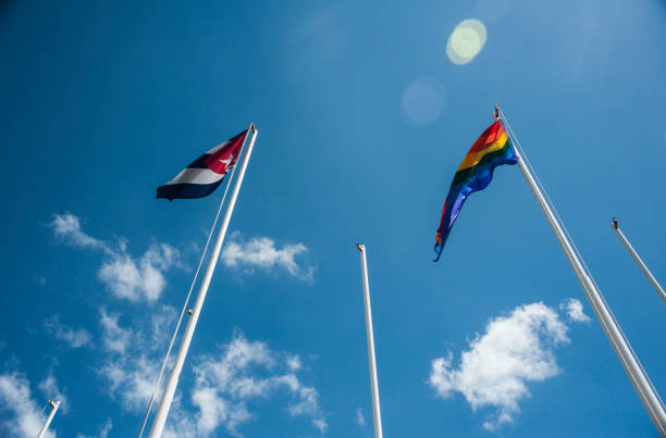 Rainbow and Cuban flags fly together in Cuba for the first time in Varadero, Cuba. stock photo