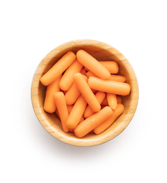 baby carrot vegetable. mini orange carrots isolated on white background. - carrot isolated white carotene imagens e fotografias de stock