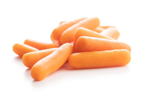 baby carrot vegetable. mini orange carrots isolated on white background. - carrot isolated white carotene imagens e fotografias de stock