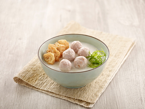 Handmade Meatball Congee served in a dish isolated on mat side view on grey background