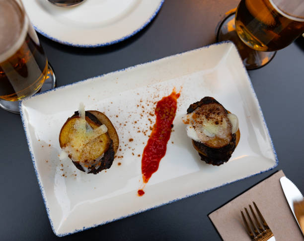 Spanish timbale of morcilla with caramelized pears and cheese