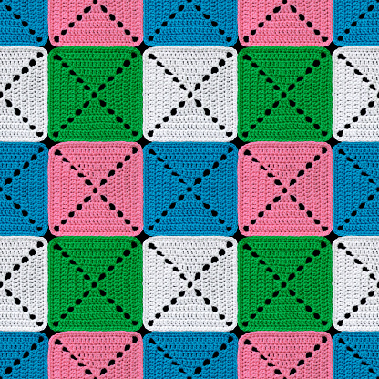 Seamless knitted pattern in patchwork style. The geometric elements are crocheted from multi-colored acrylic yarn. Contrasting colors.