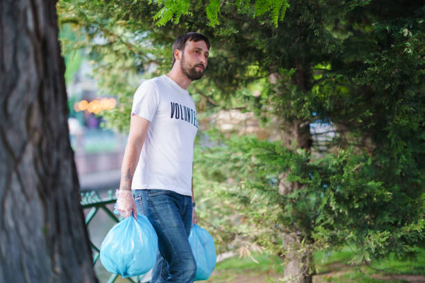 istock Volunteer people are environmental cleaning 1403129924