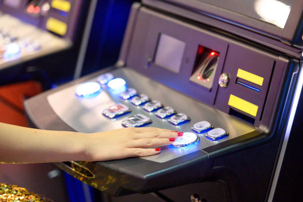 istock Woman playing on slot machine 1403130585