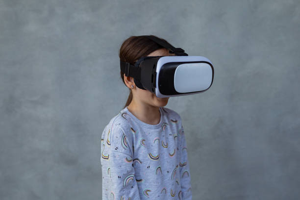 istock Little girl with virtual reality simulator 1403132038