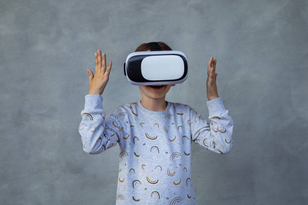istock Girl looks at the virtual glasses 1403132096