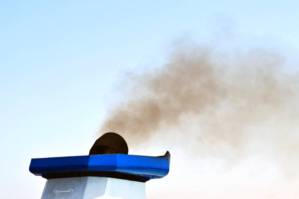 istock Black smoke from the funnel of a ship 1403132386