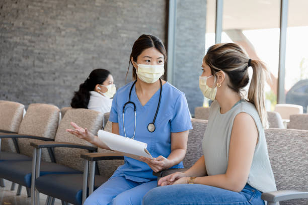 istock Nurse meets with female patient 1403133182