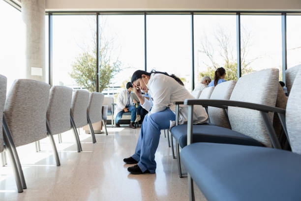 istock Exhausted physician sits in the lobby 1403133197