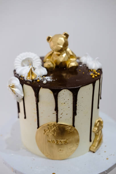 istock chocolate cake with a gold bear and stars on a white plate 1403138134