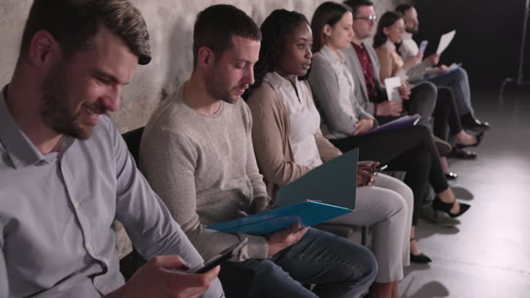 Business people waiting for a job interview in waiting room