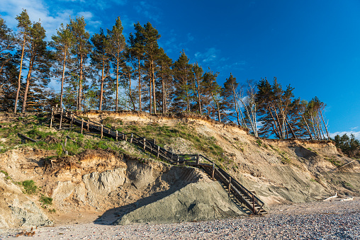 Steep shore of the Baltic Sea and wooden stairs, Labrags, Latvia.