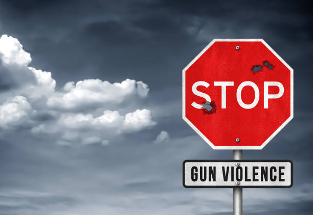 Stop Gun Violence - road sign Stop Gun Violence - road sign gun violence  stock pictures, royalty-free photos & images