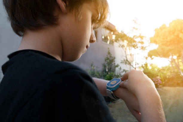 Boy calling his mother on his smart watch.