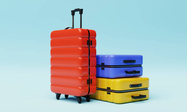 valigie trolley colorate su sfondo azzurro. oggetto di viaggio e concetto di voglia di viaggiare. rendering di illustrazioni 3d - baggage wagon foto e immagini stock