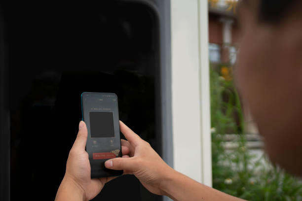 istock Men scan charging devices with mobile phones 1403167234
