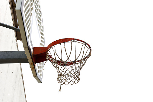 Low angle view of basketball hoop on a concrete wall with copy space.