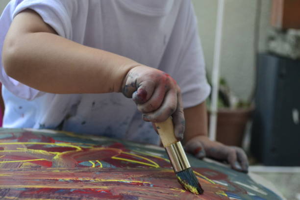 istock Girl painting 1403172374