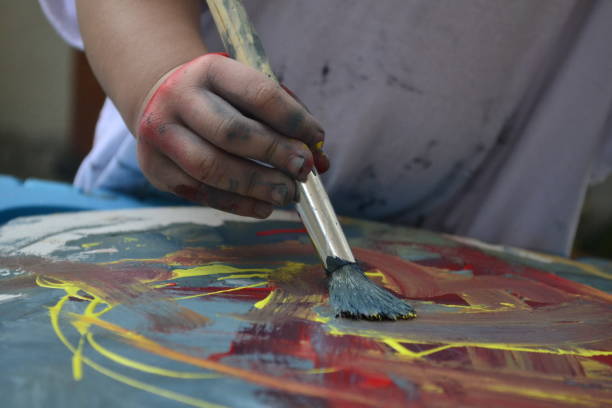 istock Girl painting 1403172389