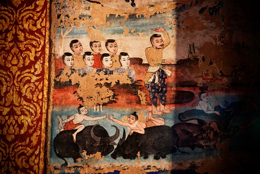 The beauty of ancient Thai murals inside the temple, about 158 ​​years old, at Wat Phra Singh, Chiang Mai, Thailand.