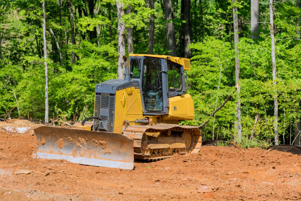 Excavators during landscaping works at construction site stock photo