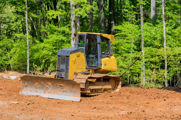 excavators during landscaping works at construction site - archaeology imagens e fotografias de stock