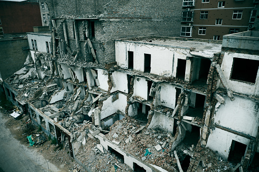 The old wooden damaged burned-down house a view from inside