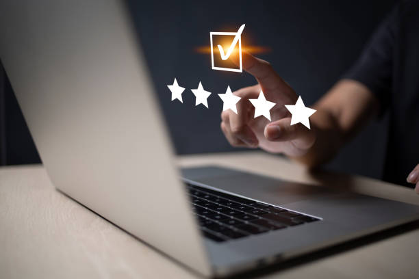 istock Satisfaction and customer service survey concept, business people using  laptop. to answer the questionnaire And the satisfaction rating, the satisfaction rating with the smiley face icon 5 stars. 1403179499