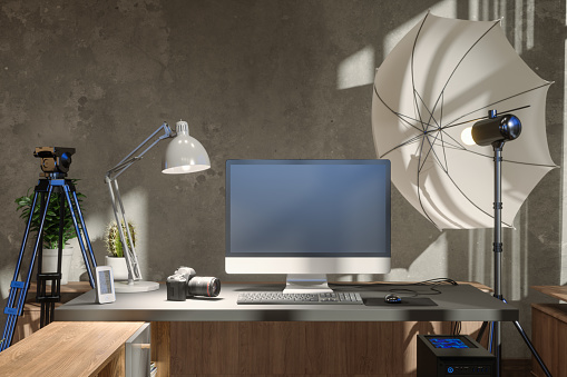 Photo Studio Interior With Study Desk, Computer, And Photographic Equipments