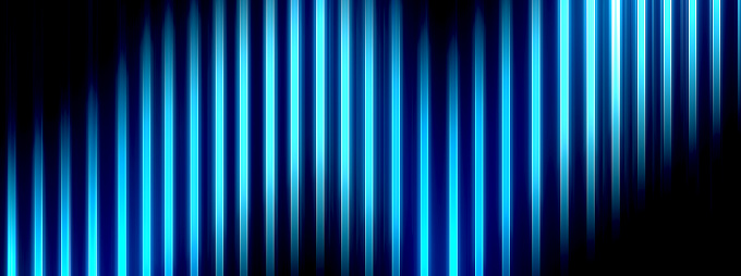 Wave pattern of blue light shining on a black background