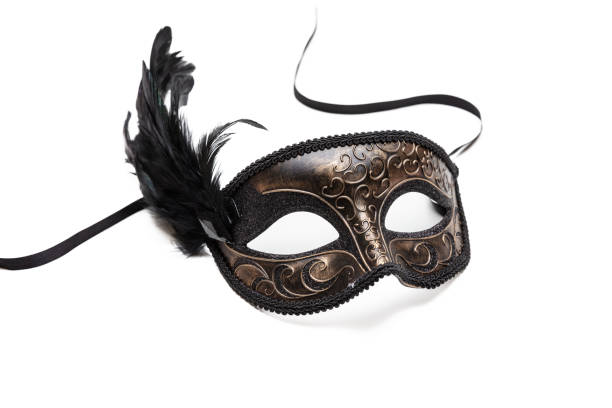 istock Carnival mask brown color with black feather decoration isolated on white background 1403189247