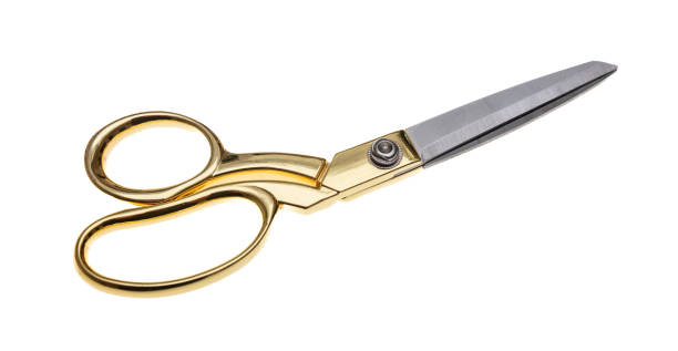 istock Pair of scissors with golden handle isolated cutout on white background 1403189280