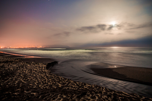 Panorama at dawn of objects in solar system in june 2020 with comet Neowise, Jupiter, Saturn, Mars, Venus and the Moon over field with old barn